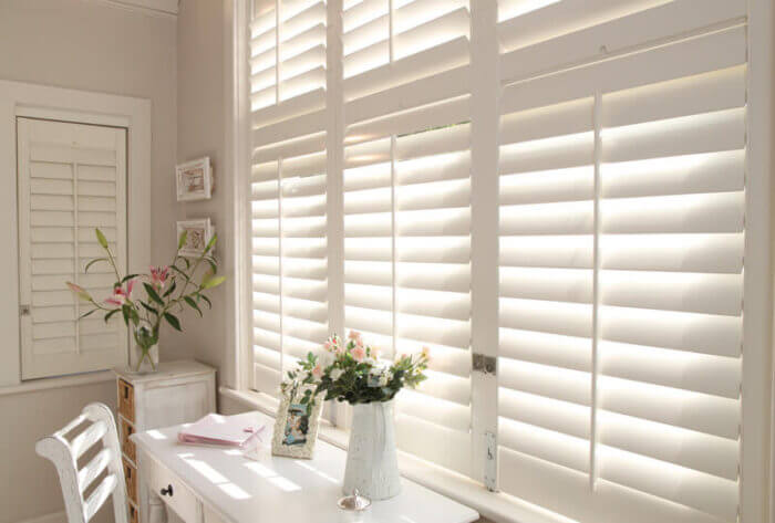 Plantation shutters installed in a Manchester living room